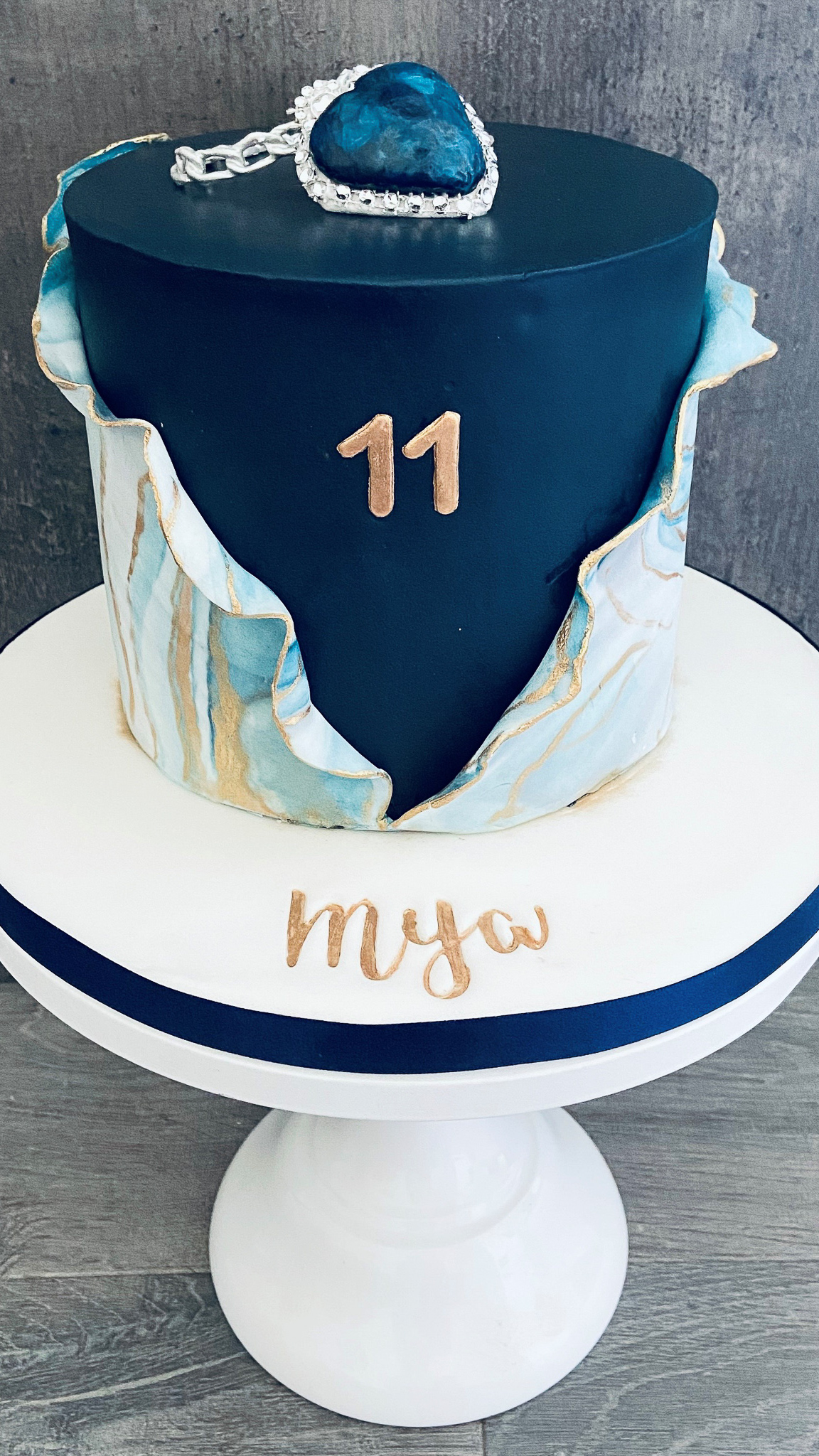 Titanic themed stylish cake with marble wrap