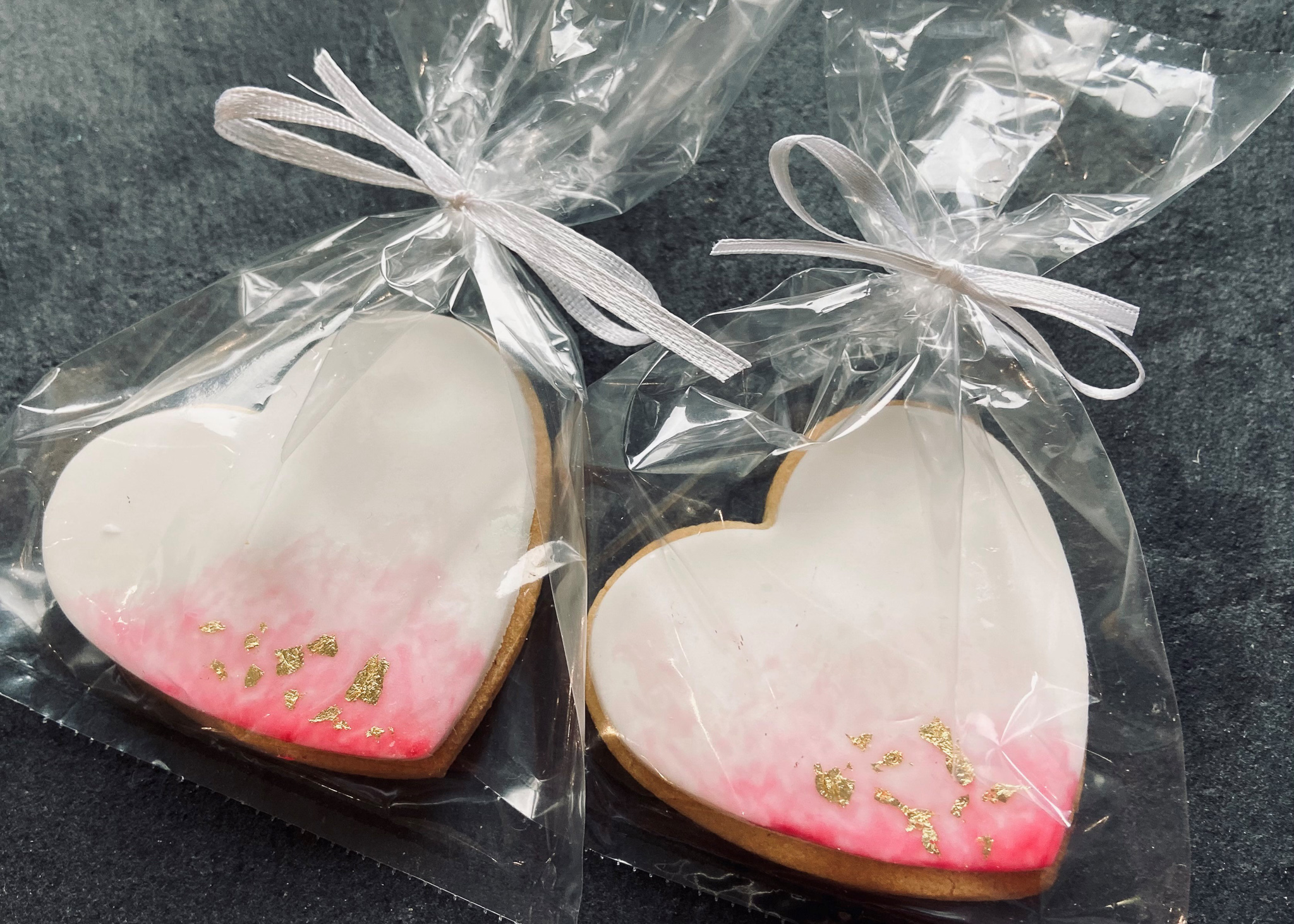 Pink wedding favour iced biscuits