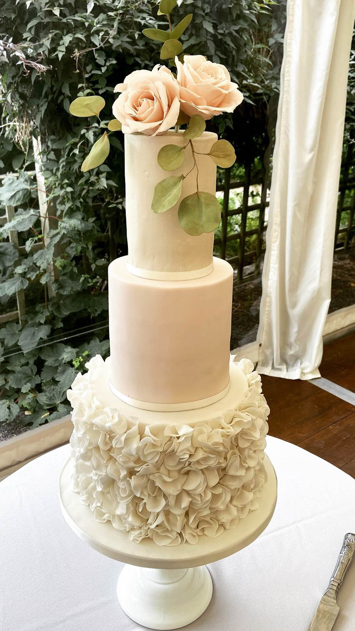 Pretty 3 tier wedding cake sugar flowers sugar ruffles Elsick House Aberdeenshire Scotland